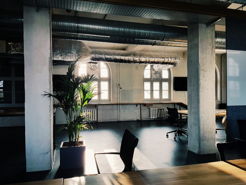 high ceiling loft start-up office with arch windows